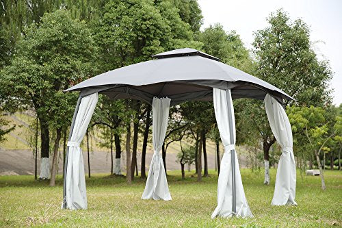 Cenador Elegante de Acero con Mosquitera de 4 Cremalleras 3X3 m. Vista general. Vista en bonito jardín. Angel Living | maxjardin