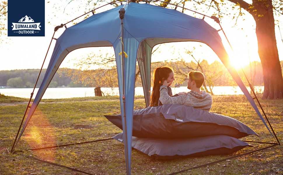 Carpa automontable en 10 segundos para camping o festival de Lumaland. Detalle en atardecer junto a un río