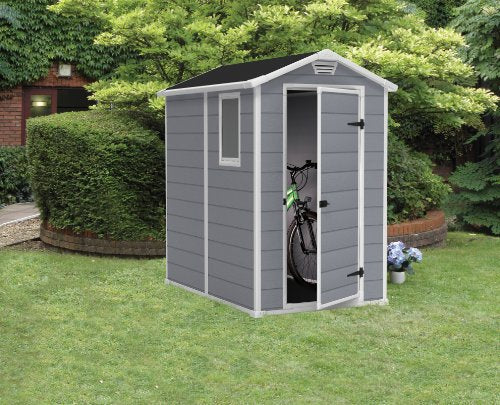 Caseta de jardín con suelo Manor 4X6 S Shed, sistema de ventilación, puerta y ventana, resistente al agua, color gris. 198x192x130 cm. Vista en jardín. Keter